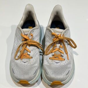 Hoka White and Light Blue Running Shoes with Orange Laces